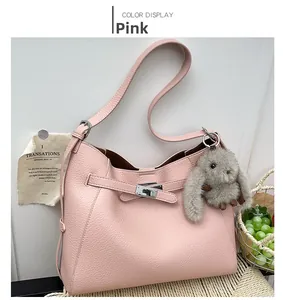Pink lychee grain leather bucket bag with silver lock and cute grey bunny pendant