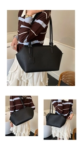 Détail du grand sac cabas noir en cuir grainé au design géométrique et fines lanières