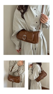 Detail showing vintage brown PU leather shoulder bag with silver buckle and crossbody strap