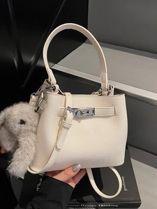 Off-white lychee leather bucket handbag with silver twist lock and plush rabbit charm