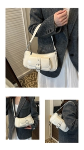 Detail of cream glossy patent leather underarm bag with silver buckle and small front pocket