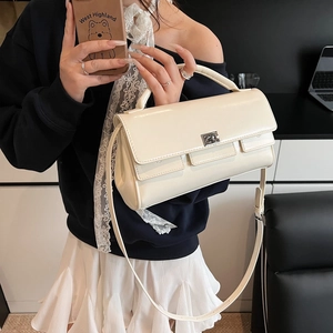 Chic beige glossy flap handbag with silver metal buckle and adjustable shoulder strap