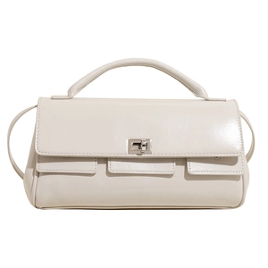 Chic beige flap handbag with silver twist lock and shoulder strap on white background