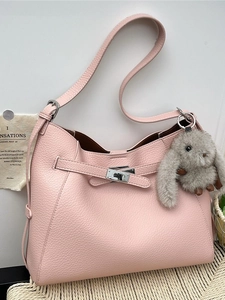 Pink lychee grain leather hobo bag with silver turn-lock and cute bunny pendant