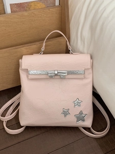 Pink casual backpack for women with silver stars and bow detail on a textured finish