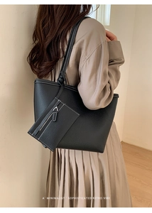 Detailansicht der schwarzen Tote Bag aus genarbtem Leder mit weißen Kontrastnähten