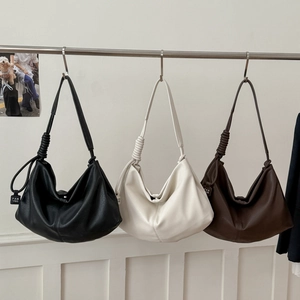 Minimalist large capacity tote bag in black, beige, and brown with knotted strap detail