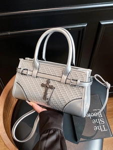 Silver woven handbag with gothic cross charm and adjustable shoulder strap for women