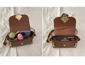 Détails de l'intérieur du sac en cuir marron montrant une grande capacité de rangement