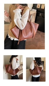 Detail view of large capacity dark brown pleated leather tote bag with unique wing design