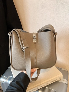 Chic grey lychee leather bucket bag with silver twist lock and wide shoulder strap