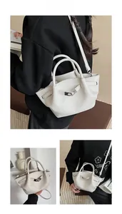 Detailed views of a white lychee grain leather handbag with silver metal hardware