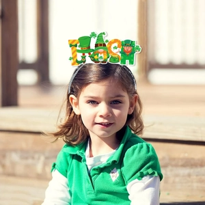 Girl wearing Irish St. Patrick's Day headband with shamrock gnome and IRISH letters