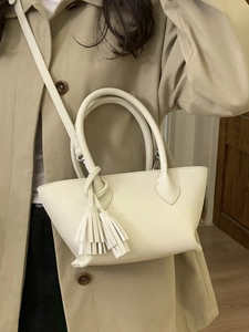 Chic cream white leather crossbody handbag for women with elegant tassel decoration