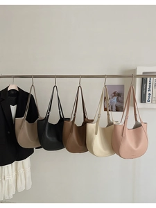 Detailed display of tote bags in five colors with soft lychee leather and adjustable straps