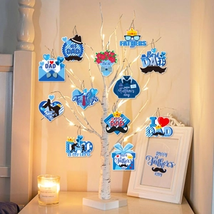 Father's Day hanging ornaments with tie and shirt shapes on a lit decorative branch