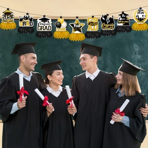Hanging 2026 graduation party honeycomb decorations featuring stars and mortarboards