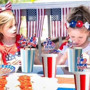 Detail of July 4th party straw toppers with USA flags and eagles for picnic decoration