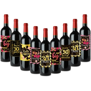 Detail of 9 assorted 30th birthday wine bottle labels with gold and pink party themes