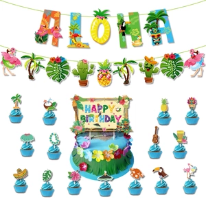 Detail view of Hawaii Aloha party decorations with tropical cake toppers and banners