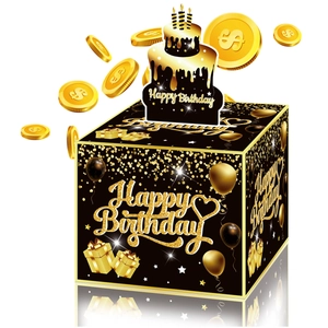 Scatola regalo a sorpresa nera e oro per compleanno con decorazione a torta e monete d'oro