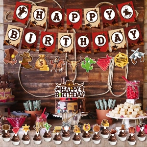 Cowboy themed birthday party set with banner and cupcake toppers on vintage wood backdrop