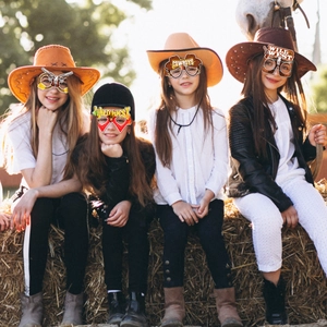 Kids wild west cowboy themed party paper glasses and hats for fun photo booth props