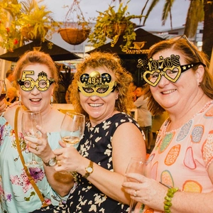 50th birthday party glasses with gold glitter crowns and 1976 heart frames for women