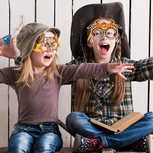Western Cowboy themed party paper glasses with Wild West motifs for kids party decor
