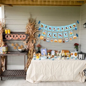 Detail of Oktoberfest party set with banner, cupcake toppers, and festive decorations