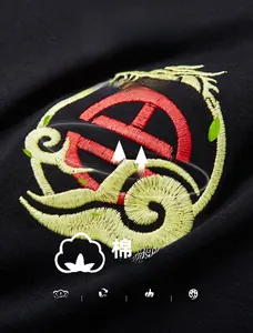 Close-up of premium dragon embroidery and 95% cotton fabric texture on black t-shirt