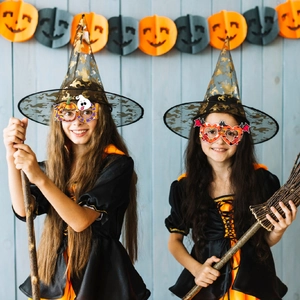 Kids Halloween witch costume set with orange tiered dress, wizard hat and themed glasses