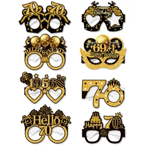 Set of eight black and gold 70th birthday party paper glasses with glitter accents