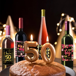 Detail of elegant Cheers to 50 Years wine bottle labels for birthday party decor