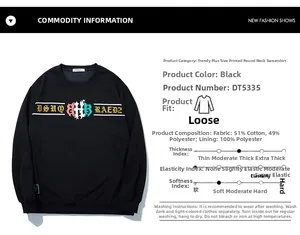 Detail of black oversized sweatshirt featuring cotton blend fabric and letter print