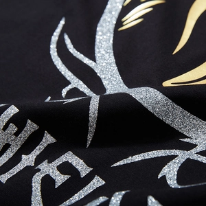 T-shirt noir oversize en coton avec lettrage pailleté métallique et imprimés graphiques dorés