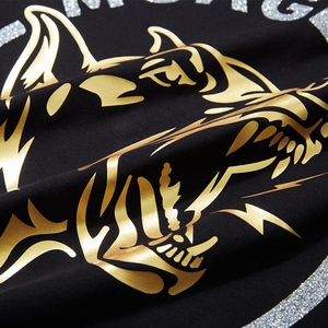 T-shirt noir oversize ample avec imprimé tête de chien doré et lettrage pailleté argent