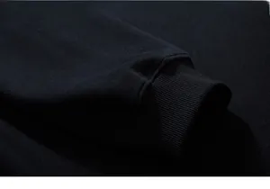 Close-up detail of high-quality ribbed cuffs on black cotton heavyweight sweatshirt