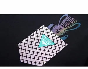 Macro shot of colorful holographic rabbit print on black cotton oversized sweatshirt
