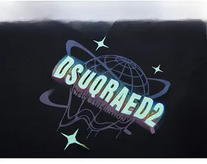 Macro view of gradient brand lettering and globe graphic on black oversized hoodie