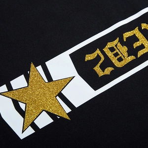 Oversized hoodie with gothic 2023 lettering and sparkling gold star print design