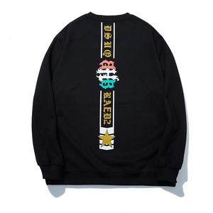 Oversized black crewneck sweatshirt with gothic lettering and star print on back