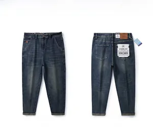 Flat lay of vintage washed dark blue straight-leg jeans showing front and back views