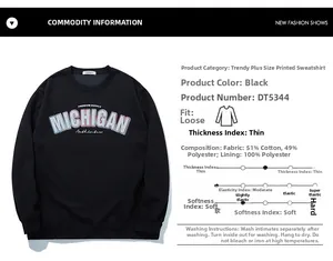 Detail view of black oversized sweatshirt fabric specs and Michigan graphic print