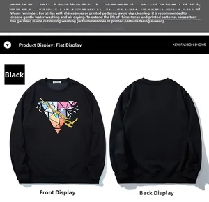 Detail of black crewneck sweatshirt featuring colorful geometric triangle and gold lettering