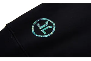 Macro view of black knitted fabric texture with high-quality circular logo print