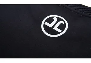 Close-up of ribbed neckline and white logo print on black cotton oversized sweatshirt