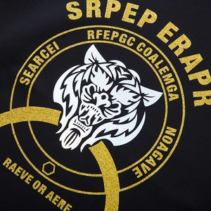 Oversized black hoodie featuring a detailed white tiger head print with gold glitter accents