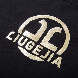 Men's loose black sweatshirt featuring a premium gold metallic letter print on the chest