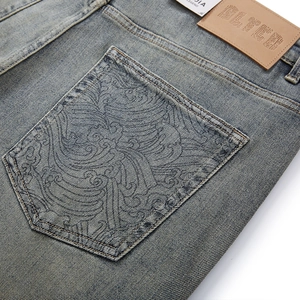 Vintage wash loose straight jeans with intricate wave embroidery on the back pocket